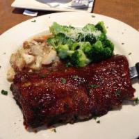 Ribs · A full rack of All-American pork ribs smothered with barbecue sauce and slow roasted to perf...