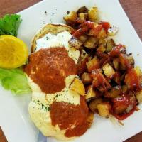 Crab Cake Benedict · 2 grilled crab cakes and 2 poached eggs on a toasted English muffin. Served with a side of h...
