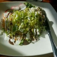 Quesadillas Fritas · Corn tortilla stuffed with cheese and deep fried. Topped with black bean sauce, salsa, cream...