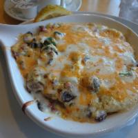 Tiny Tim's Farm Stand · Fresh spinach, mushrooms and diced bacon, topped with Jack and cheddar cheeses. Whipped up w...