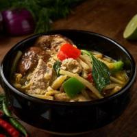 Green Curry · Served hot and spicy. Made with Thai eggplant, bamboo shoot, hot pepper, string bean, and ba...