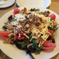 Tuscan Salad · Mesculin lettuce, tomatoes, roasted red peppers, marinated mushrooms, walnuts, and mozzarella.