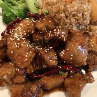 Sesame Chicken · Dark meat crispy chicken in a sweet and spicy sesame sauce. Served with your choice of rice.