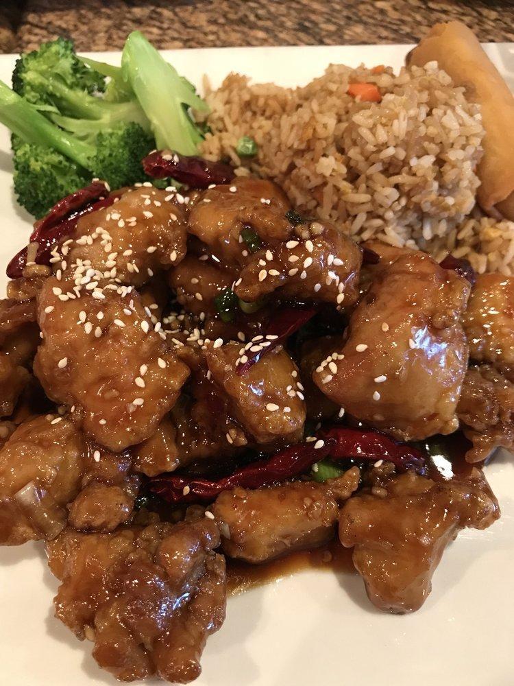 Sesame Chicken · Dark meat crispy chicken in a sweet and spicy sesame sauce. Served with your choice of rice.