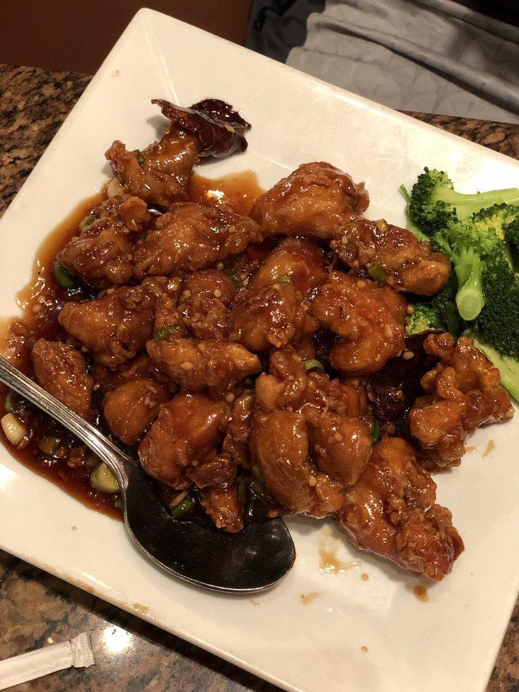 Orange Chicken · Fried dark meat chicken tossed with fresh orange peel and sauteed in a sweet and spicy sauce. Served with your choice of rice.