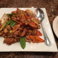 Hunan Chicken · Dark meat chicken stir-fried with assorted vegetables in spicy brown sauce. Served with your...