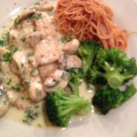 Tilapia · Parmesan crust with brochette over pasta and lemon butter.