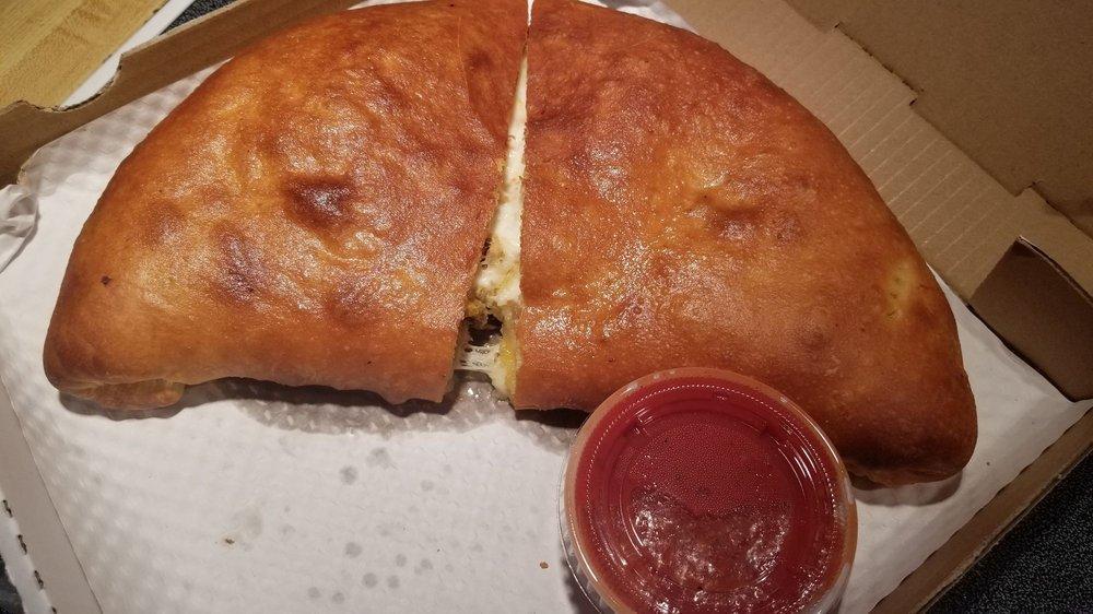 Stromboli · Mozzarella cheese, mustard salami, candian bacon and Italian sausage wrapped in pizza dough and stone baked to golden perfection.