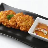 Sweet Corn Fritters · Fresh sweet corn kernels mixed in a batter with Thai curry paste (4 pcs)