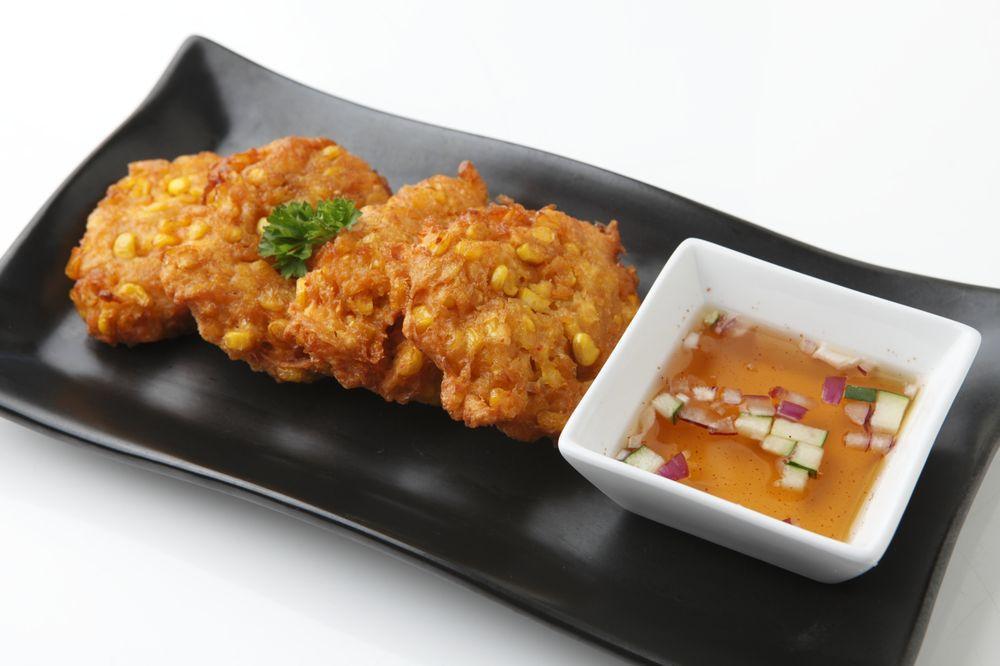 Sweet Corn Fritters · Fresh sweet corn kernels mixed in a batter with Thai curry paste (4 pcs)