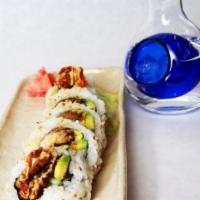 Spider Roll · Deep fried soft shell crab, cucumber, avocado, sesame seed and sweet sauce. Cooked.