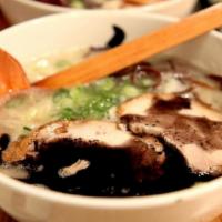 Kuro Ramen · Pork broth, 2 pieces of sliced pork, scallion, kikurage mushroom, black garlic sauce.