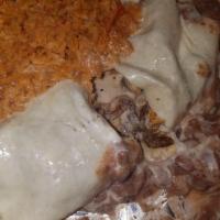 Texas Burrito · Our delicious skirt steak, grilled chicken and shrimp, rolled in a big flour tortilla and co...