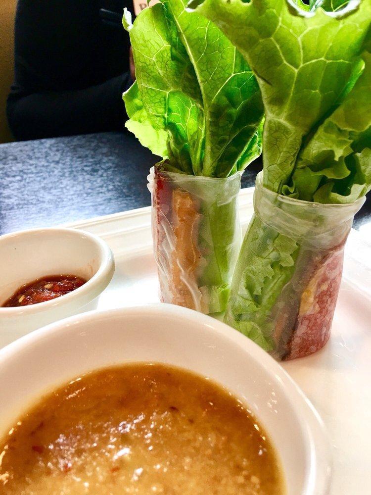 Spring Rolls · Imitation meat, lettuce, vermicelli, fresh herbs rolled in rice paper served with peanut sauce. Vegan. Contains peanuts.