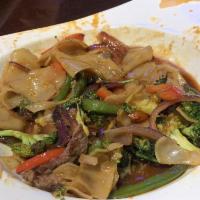 Drunken Noodles · Stir-fried wide rice noodles with colorful bell peppers, onions, broccoli, basil leaves and ...