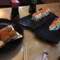 Drunken Fish Roll · Shrimp tempura, unagi, crab salad, avocado, cucumber, masago and sauce.