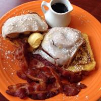 Ooey Gooey French Toast · Maple-egg dipped glazed cinnamon coffee bun grilled + served w/ 3 strips of smoked bacon.