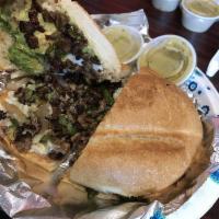Torta · Choice of meat the torte is made with avocado, cheese, jalapeños, lettuce, mayonnaise, and t...