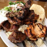 Agora Mixed Grill · Combination of chicken and lamb shish kebabs, Adana, and kofta kebabs, lamb gyros. Served wi...