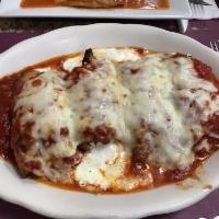 Eggplant Rollatini · Rolled and filled with ricotta cheese then topped with fresh tomato sauce and melted mozzare...