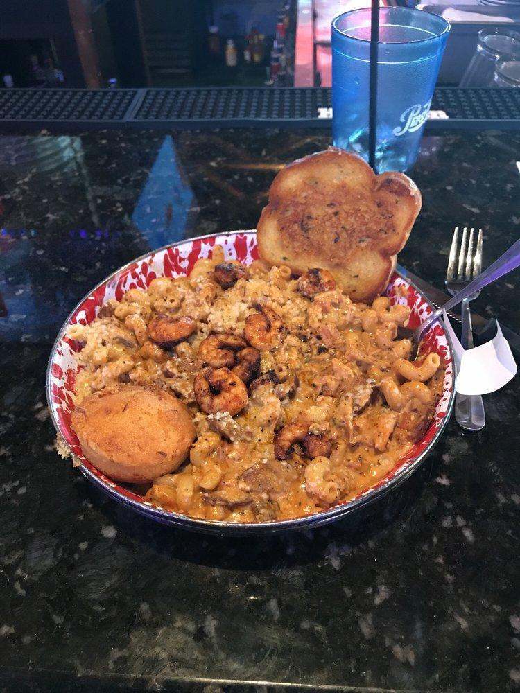 Jasper's Creole Pasta · Jethro's famous andouille sausage with smoked chicken tossed with pigtail pasta springs and plum tomatoes smothered with Jessie Bob's Creole cream sauce, topped with Parmesan cheese.