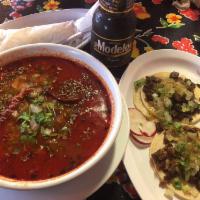 Menudo · Our Menudo consists of: Slow cooked beef honeycomb tripe,knuckle and hominy stew, flavored w...