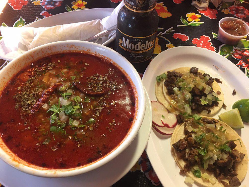 Menudo · Our Menudo consists of: Slow cooked beef honeycomb tripe,knuckle and hominy stew, flavored with dry California chiles and a blend of spices, served with raw onions, cilantro, mexican oregano, lime and red bird beak pepper, and your choice of corn or flour tortillas.