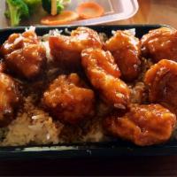 Orange Chicken · Crispy white meat chicken, sweet brown orange sauce, served with steamed broccoli and carrot...