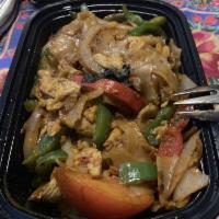 Pad Kee Mow · Stir fried fresh big flat noodles, broccoli, carrots, egg, garlic, tomato and Thai basil. Se...