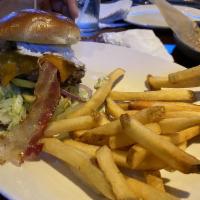 Bison Burger · Candied thick-cut bacon, jalapeño-cilantro mayo, cheddar cheese, lettuce, tomato, pickles, a...