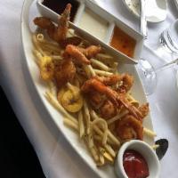 Kid's Coconut Shrimp · Four shrimp served with citrus chili sauce and fries.