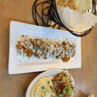 Mantu · Meat dumplings. Homemade pastry shells filled with seasoned beef, onions, herbs and spices, ...