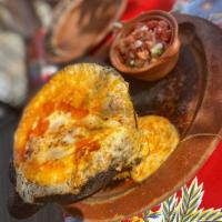 Queso Fundido · Melted cheese mixed with either Mexican sausage, poblano slice or mushrooms and served with ...