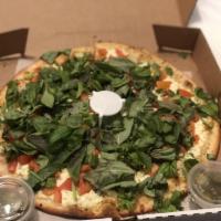 Armenian Pizza · Made with white sauce, feta cheese, tomato, basil and cilantro.