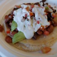Super Taco · Two tortillas, meat, cheese, beans, pico de gallo, sour cream, and avocado.
