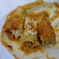 Enchiladas · 4  chicken enchiladas, smothered in melted jack cheese and your choice of our house red or g...