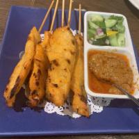 Chicken Satay · Chicken on skewers, served with peanut sauce and cucumber salad.