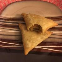 Vegetable Samosas 2 Pieces · Triangular puffed pastry stuffed with cubed potatoes, green peas, carrots and mildly spiced ...