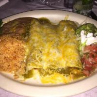 Enchiladas Rancheras · Sauteed chicken with onions, tomatoes, cilantro rolled in three corn tortillas topped with s...