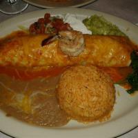 Seafood Burrito · Sauteed shrimps, calamar, fish, with mushrooms, onions wrapped in a flour tortilla topped wi...