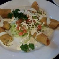 Flautas · Deep fried hand roll corn tortilla filled with chicken or steak garnished with pico de gallo...