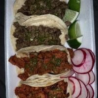 Tacos · Meat, cilantro and onions.
