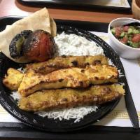 Chicken Soltani · Marinated chicken breast and chicken lule served over basmati rice, salad or french fries wi...
