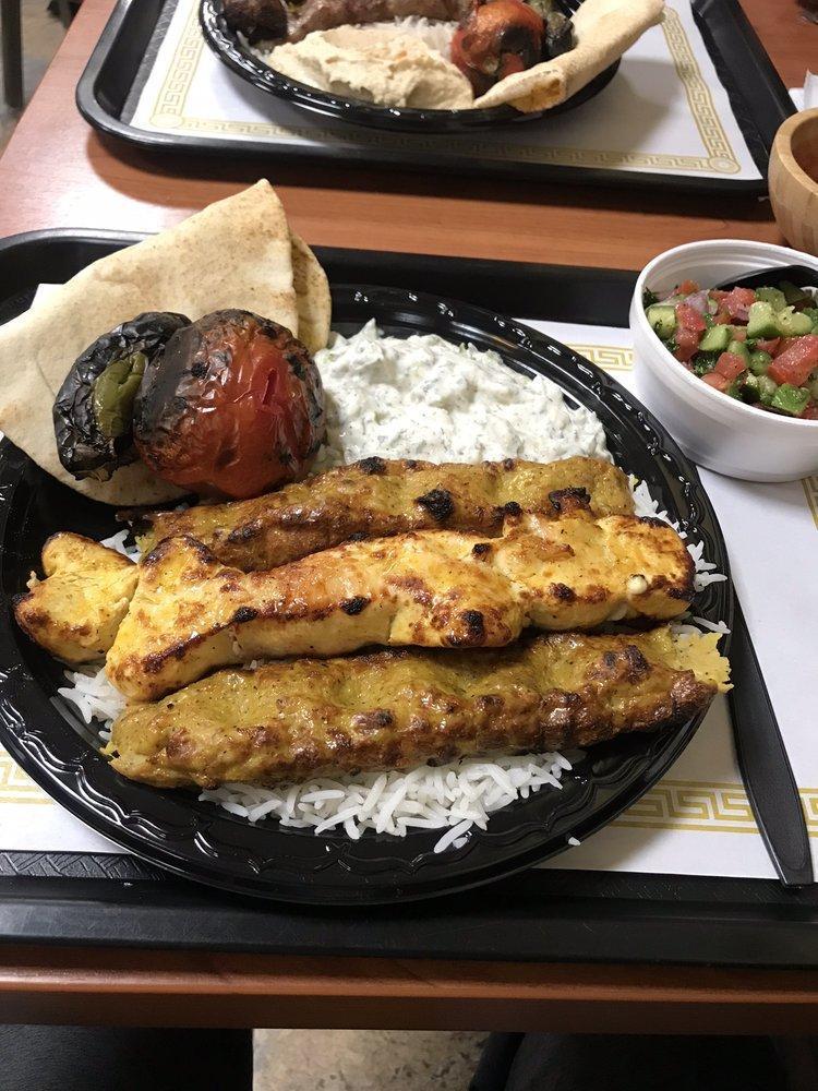 Chicken Soltani · Marinated chicken breast and chicken lule served over basmati rice, salad or french fries with 1 side dish, grilled tomato and jalapeno. 