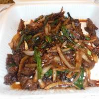 Mongolian Beef · With brown sauce and vegetables.