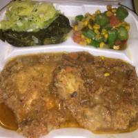Smothered Pork Chops Dinner · Includes 3 sides and a cornbread