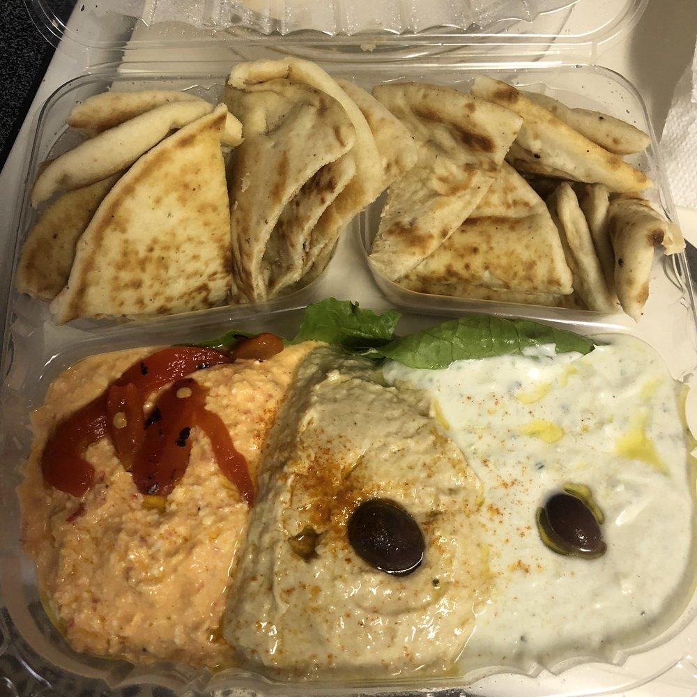 Trio Spread Platter · All of our spreads are delicious, so go ahead and try them all on this platter meant for sharing. Served with pita bread.