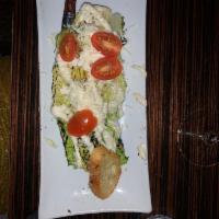Caesar Salad · Grilled romaine heart, Parmesan cheese, cherry tomatoes, with house-made Caesar dressing and...