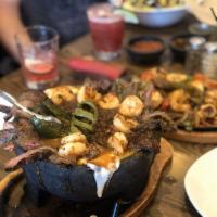Molcajete · Arroyo molcajete chicken or steak served with roasted salsa, grilled chorizo, grilled nopale...