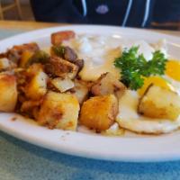Country Fried Steak and Eggs · Our famous country fried steak topped with sausage gravy and served with two eggs any style ...